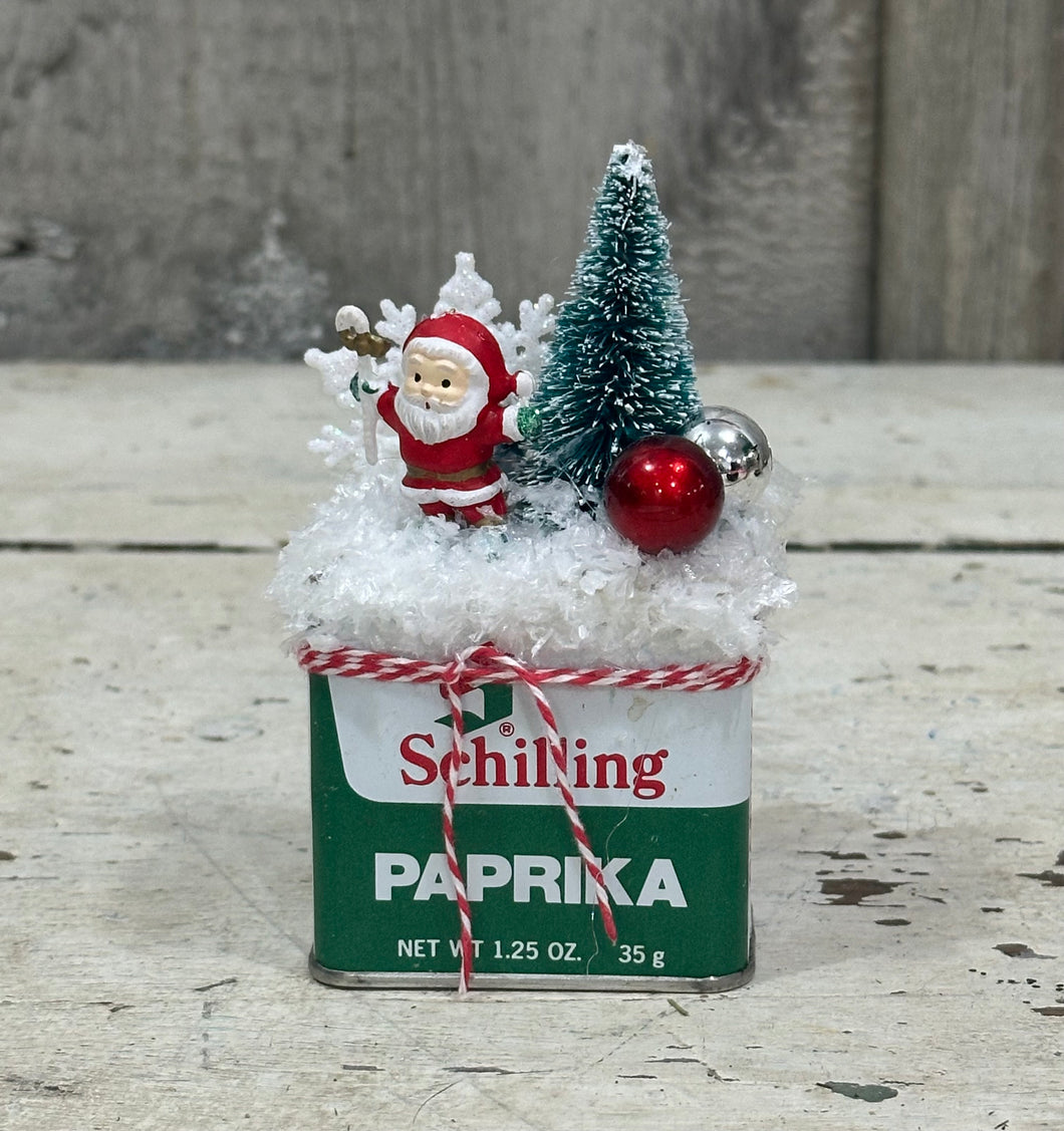 Paprika Tin w/Santa + Tree, Snowflake